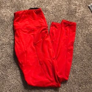Red, cropped leggings with pockets.